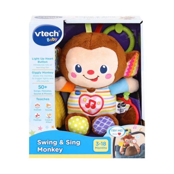 muzikalna-maimunka-za-bebe-vtech-1500 Музикална маймунка за бебе, VTech: кафява маймунка с усмивка, сърце с нота на гърдите и шарени крачета в кутия с надпис „Swing & Sing Monkey“ и логото „vtech Baby“.