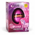 Растящо яйце еднорог: розово-лилава кутия Magic Unicorn Egg с прозорче, през което се вижда цикламената черупка с надпис Growing Pet.