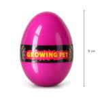 Розово яйце с черна лента Growing Pet на бял фон, с линия за височина.