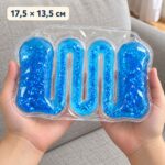 Синя сензорна тубичка Squeeze Tuberz в две детски ръце, с надпис 17,5 × 13,5 см.